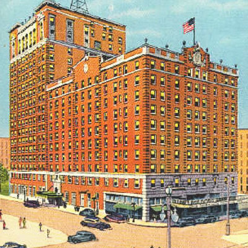 A vintage illustration of the Jung Hotel in New Orleans, featuring a large multi-story building with a rooftop tower and busy street scene.